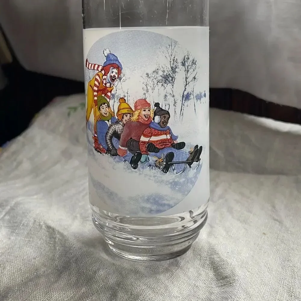Vintage Ronald McDonald winter sled scene glass.
